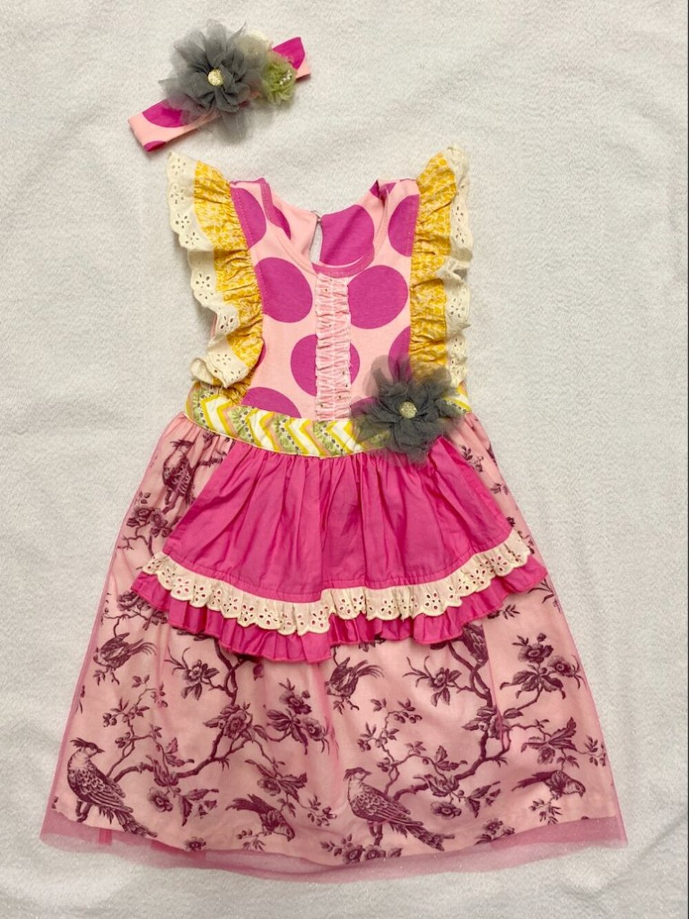 Giggle moon birdie apron dress and matching headband.